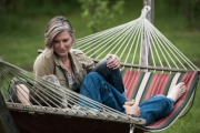 A couple enjoy a hammock at their rural home in Illinois.  Chicago photographer Alex Garcia