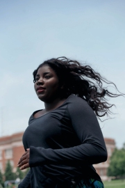 A college-bound young woman jogs around a track in Chicago. Image by Chicago photographer Alex Garcia