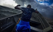 Several indigneous tribal areas that will be disrupted by the proposed canal project are only accessible by boat. Here, the second mate of a boat headed to Bangkukuk struggles to stay on his feet during a small boat advisory that was issued for the Caribbean waters. Chicago photojournalist Alex Garcia