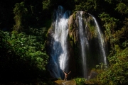 Environmental landscape picture of a man in a waterfall in Trinidad, Cuba. Image by Chicago photographer Alex Garcia