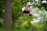 Young boy does somersaults on his way to an athletic career. Image by Chicago photographer Alex Garcia