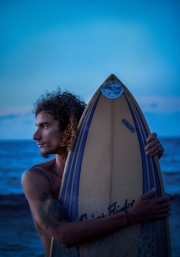 Portrait of a surfer in Havana as he looks at the waves close to sunset. Image by Chicago photographer Alex Garcia