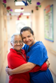 Portrait of a client and a nurse at Casa Central, a hispanic social service agency in Chicago. Image by Chicago photographer Alex Garcia