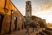 Playing soccer behind a Trinidad church in Cuba. Image by Chicago photographer Alex Garcia