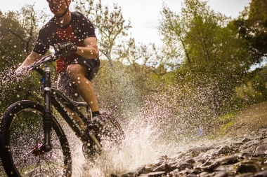 Mt Biker Luke Peterson stream crossing for Men's Journal on Cannondale Rush Bicycle