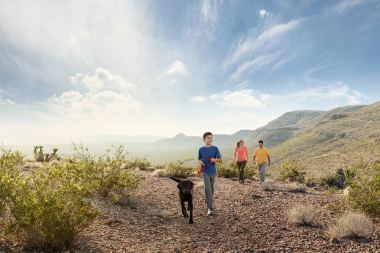 14-boy-with-Dog-and-parent-hiking-at-sun-set-Rod-McLean