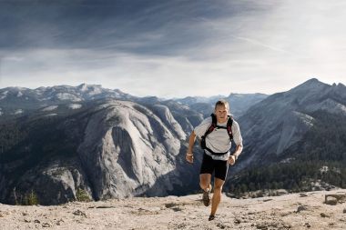 42-Athletic-lifestyle-man-charlie-engle-running-up-half-dome-Rod-McLean