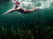 18_Athletic-Active-Lifestyle-female-swimming-red-suit-bluegreen-water-Adventure-Photographer-Rod-McLean_GG