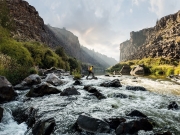 06_Active-Lifestyle-male-jimmy-chin-crossing-river-with-backpack-Adventure-Photographer-Rod-McLean_gg