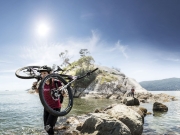 42_Athletic-Active-Lifestyle-Female-mountain-biker-Carrying-bike-over-rocks-Adventure-Photographer-Rod-McLean_gg