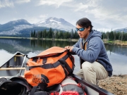 20_Active-Lifestyle-male-jimmy-chin-loading-a-canoe-with-northface-bag-Adventure-Photographer-Rod-McLean_gg_1